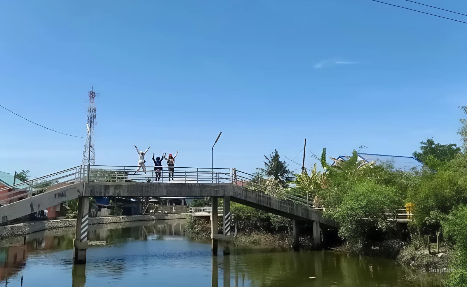 Taking a trip on a boat through a rural community.